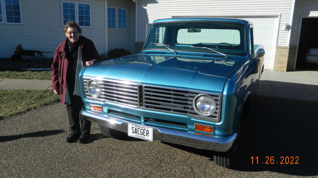 Mom standing next to my restored 1972 International Pickup that Dad bought new.